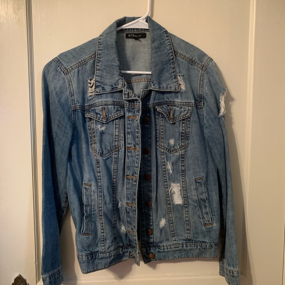 Jean Jacket distressed with holes fits like a medium is an xs